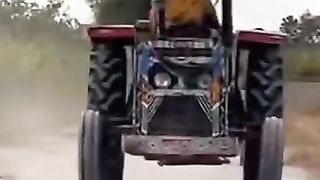 TRACTOR DRIVEN BY WOMAN