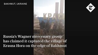 Ukraine war: Russia's Wagner mercenaries pose at entrance to 'captured' village near Bakhmut