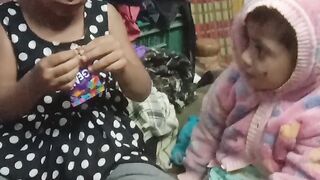 Hadiya playing with gems and eating