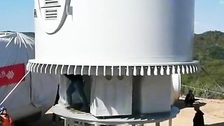 Skillfull workers establish wind power tower Base.