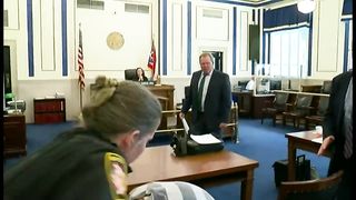 Father punches son's accused killer in Ohio court