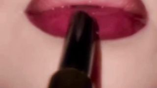 Applying lipstick