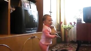 Cat takes back crying kitten from toddler