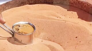 Making Tea in desert on sand