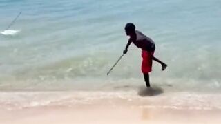 The fisherman then drops the line into the water