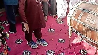 Little boye danc with pakistani doohl