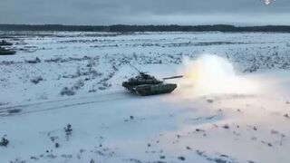 Russian battle tanks perform explosive drills on frozen battlefield
