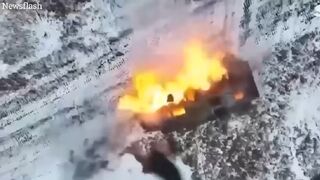 Russian tank explodes as Ukrainian drone drops bomb into open hatch