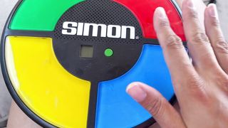 Hasbro Gaming Simon Handheld Electronic Memory Game With Lights and Sounds for Kids Ages 8 and Up