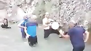 Men dance in the water