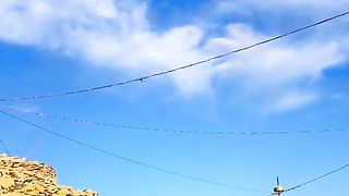 Real shot grassland building blue sky and white clouds