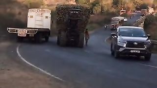 Tractor driver pulling ipnsane lode and steering  the mujnoon
