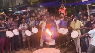 Amazing band playing drums with fire on the drums