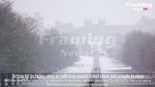 Britain hit by heavy snow as cold snap causes travel chaos and schools to close
