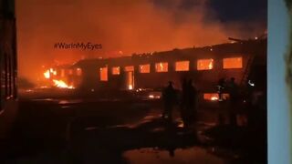 A depot in Donetsk still on fire after being hit earlier today