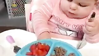 Cute child eating food