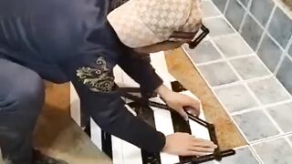 Young Man with great tiling skills -Great tiling skills -Great technique in construction.Video 2023