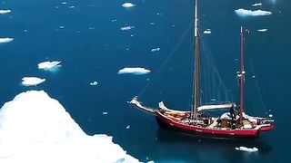 Cold and clear waters of the ice-filled Fjords in Greenland. It's a magical place waiting to be explored!