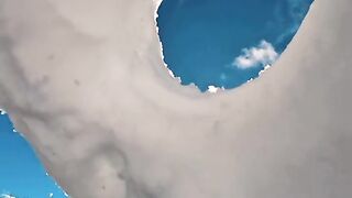 Donut-shaped ice makes an incredible water splash.