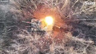 Russian tanks explode as Ukrainian drones drop bombs into open hatches