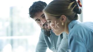 A senior business woman briefing her subordinate