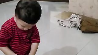 Abang plays inside the house