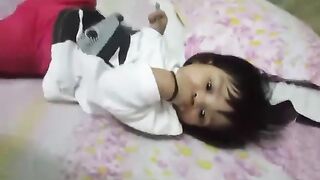 Tiny Wonder: Watch this Adorable Infant Play and Explore Her Fingers