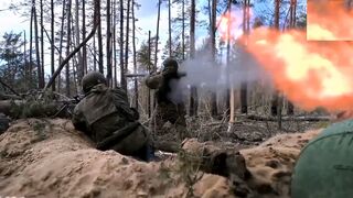 Russian soldiers fire huge handheld rocket launchers at Ukrainian troops
