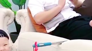 Cute baby eating grapes with papa