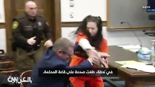 Handcuffed, a camera captures the moment a murder suspect attacked her lawyer in the courtroom