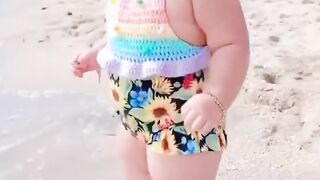 Cute baby fun on beach