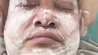 Man gets a relaxing shave and facial