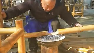 Bending bamboo on heat to make a table and chairs!