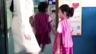 Teacher greets each kid with a dance move