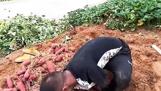 Armless guy picks and washes sweet potatoes himself