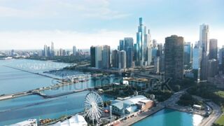 Chicago Illinois USA aerial drone footage of Chicago Navy Pier with Downtown skyscraper on cinematic background.