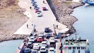 Cars getting on and off a ship