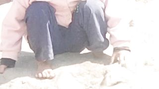 Cute baby girl playing with sand