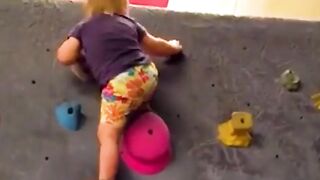 Watch this talented toddler scale 7-foot-high wall emulating Olympic sport climbers.