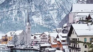 Cozy Homes with Breathtaking Views of Icy Mountains and a Serene River"