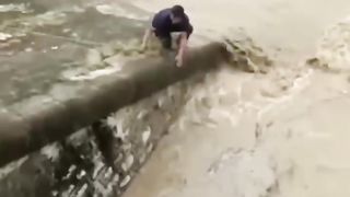 Saving The Little Dog From Drowning