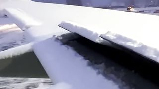"Ensuring Safe Takeoff: The Process of De-icing a Wing Before Takeoff"