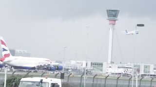 A flight starts its journey amid heavy winds and rain