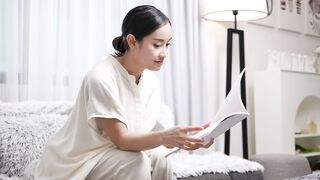 Rission Girl On Sofa reading Book Free Footage