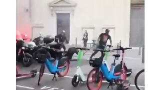 It looks like two camps of supporters of a football club are fighting in a public place