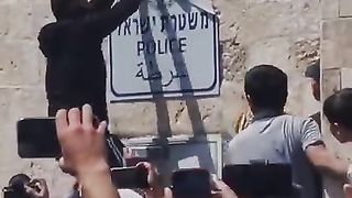 Boy courage for destruction of Israel Police tag