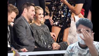 Carrie underwood Smartly Stop Travis Kelce to Kiss Her at CMT Awards 2023 - Carrie underwood
