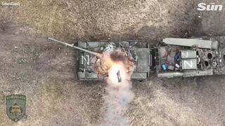 Ukrainian drone drops bomb into open Russian tank hatch with precision