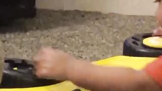 Little mechanic fixing his Ferrari