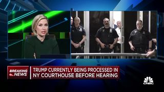 Donald Trump enters New York City courtroom following arrest processing